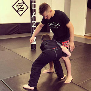 Learning BJJ Takedowns at Submit Autism Class